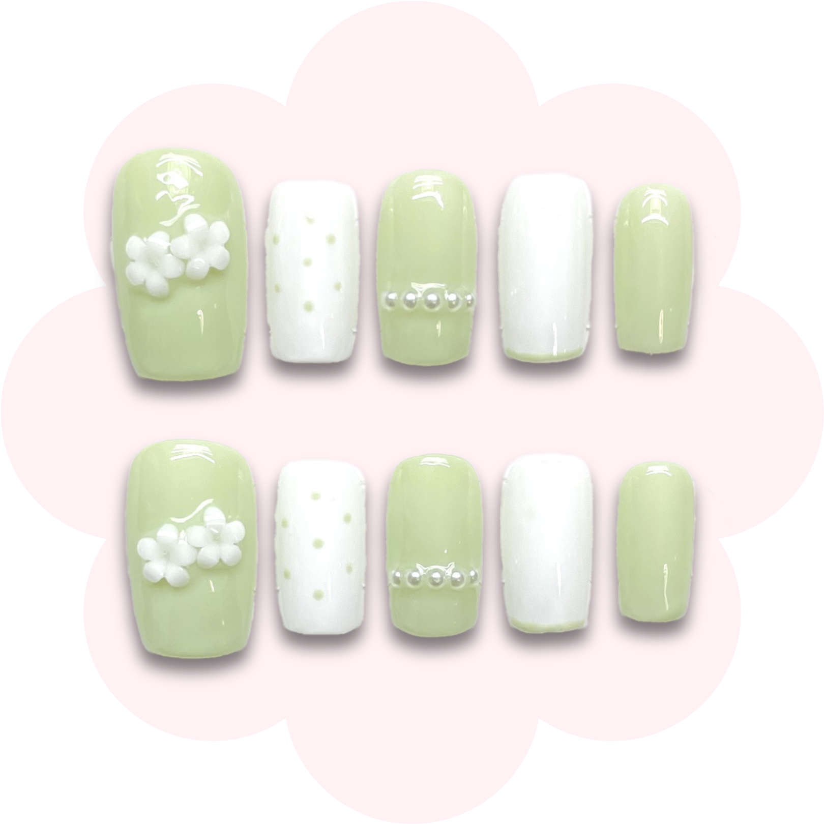 cute long lasting reusable press on nails featuring small flower embellishments and pearl accents on a light green base. 