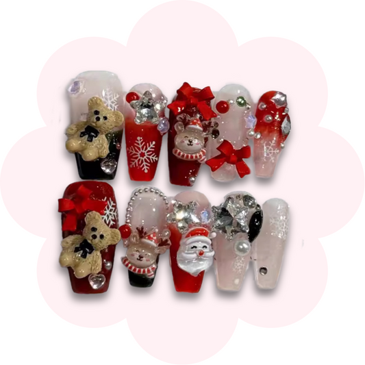 christmas nail art press on nails featuring Santa, reindeer and teddybear charms with cute bow, pearl and rhinestone accents.