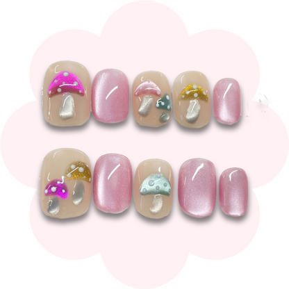 pink cat eye press on nail with enchanting mushroom accents, blending a soft shimmer with whimsical forest-inspired charm