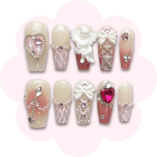 love themed long coffin press on nails featuring bows, a cupid and heart details. perfect for romantic occasions like valentines's day or date night