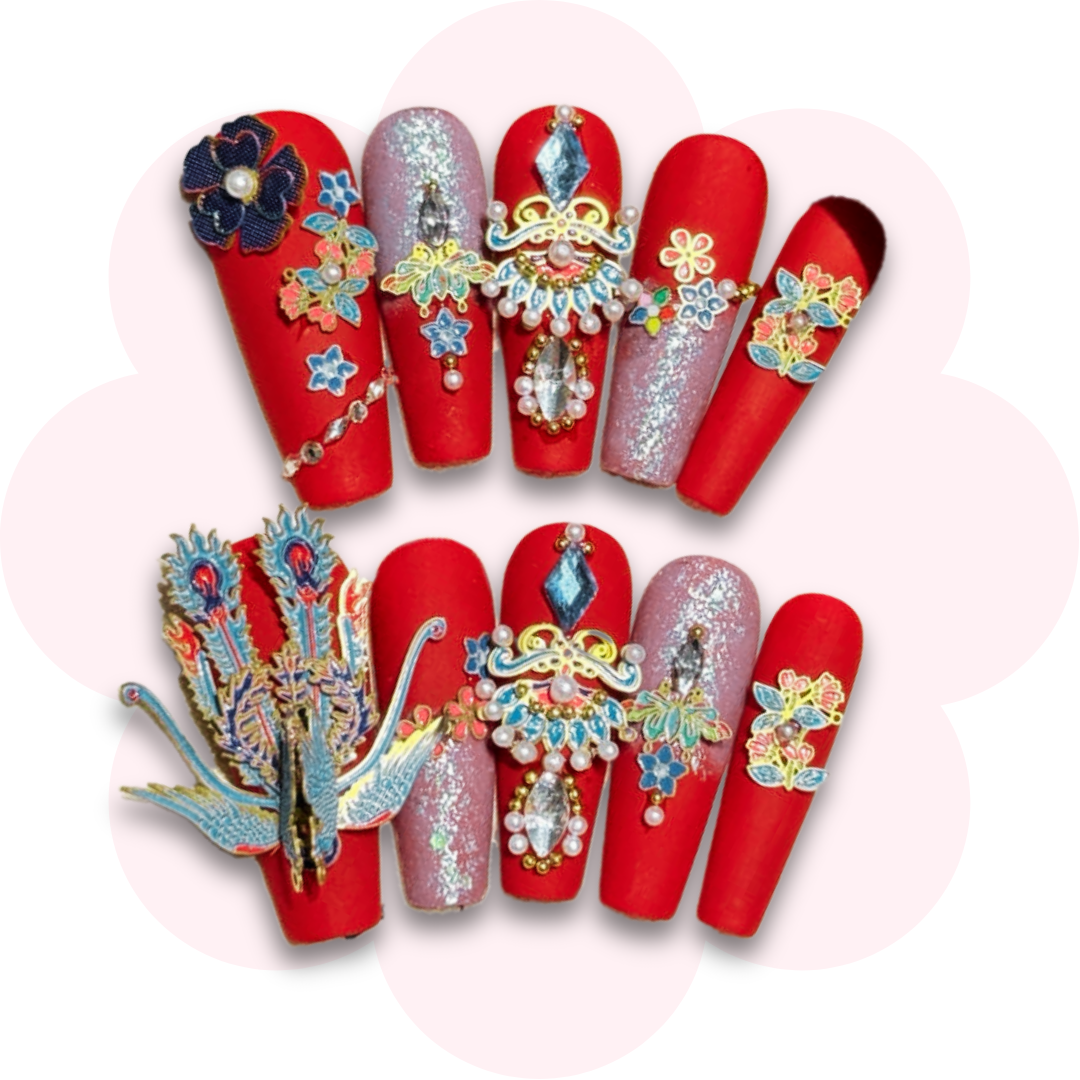 luxurious red long coffin ballerina press on nails featuring intricate 3d embellishments, including a peacock, floral designs and sparkling crystals for a bold sophisticated look