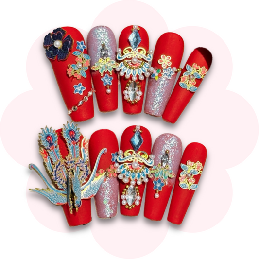luxurious peacock nail design in red long coffin ballerina press on nails featuring intricate 3d embellishments, including a peacock, floral designs and sparkling crystals for a bold sophisticated look