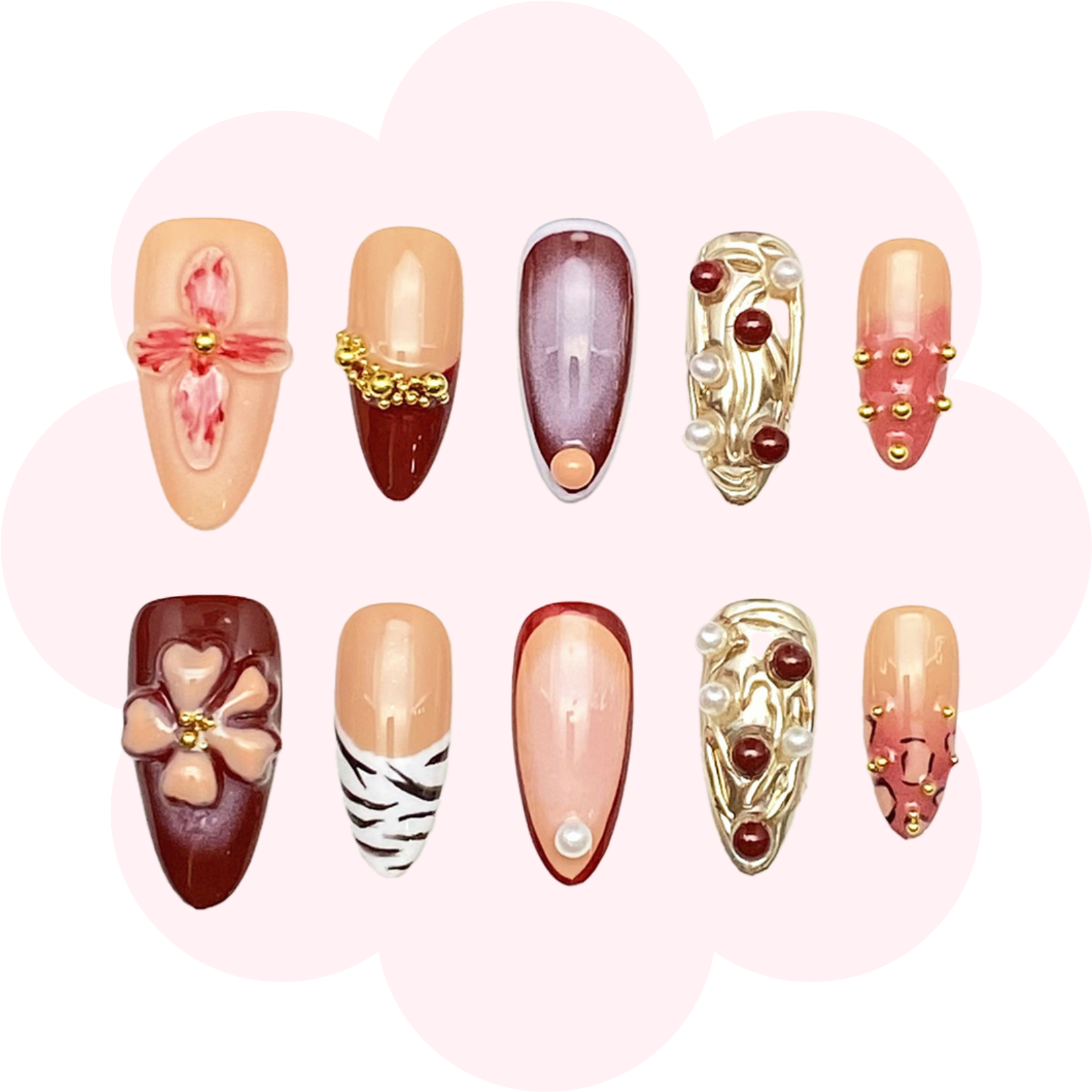 press on nail in medium almond shape featuring a mix f designs, including 3D orchids, pearls, maroon and gold accents, chic zebra patterns and gradient shades. perfect for an elegant and modern manicure.