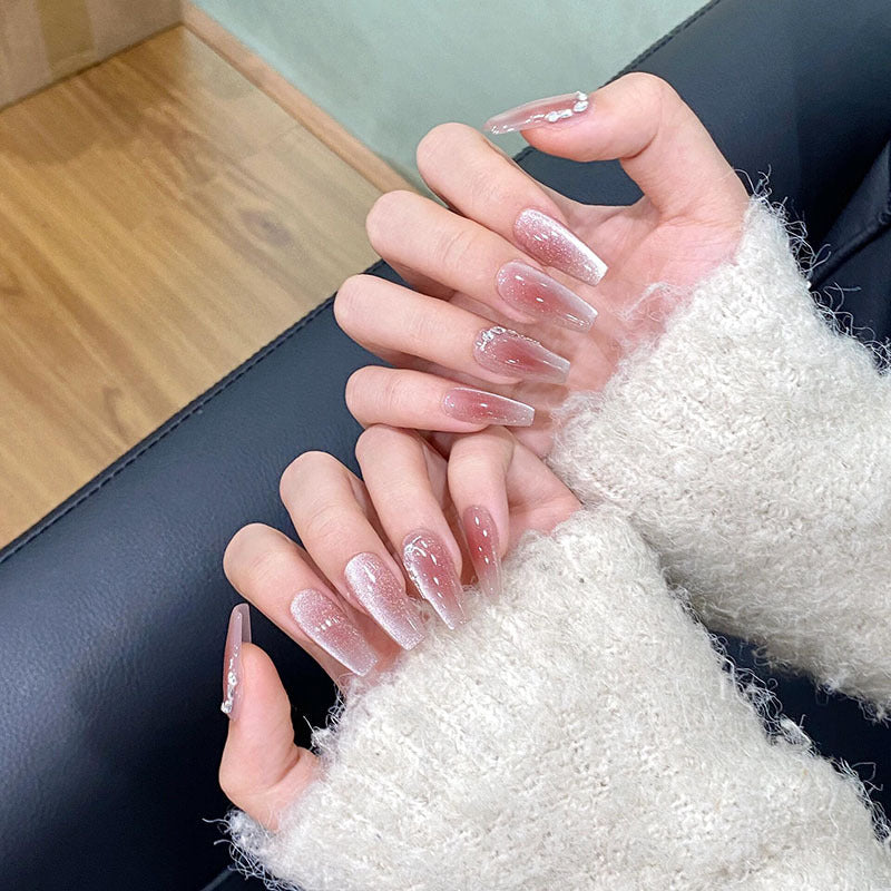 strawberry milk cats eye nails on hand